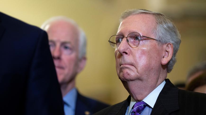 U.S. Senate Majority Leader Mitch McConnell (R-KY) listens beside U.S. Senator John Cornyn (R-TX) during a news conference following the Republican weekly policy lunch on Capitol Hill in Washington, U.S., September 25, 2018. REUTERS/Al Drago - RC1580FEF870