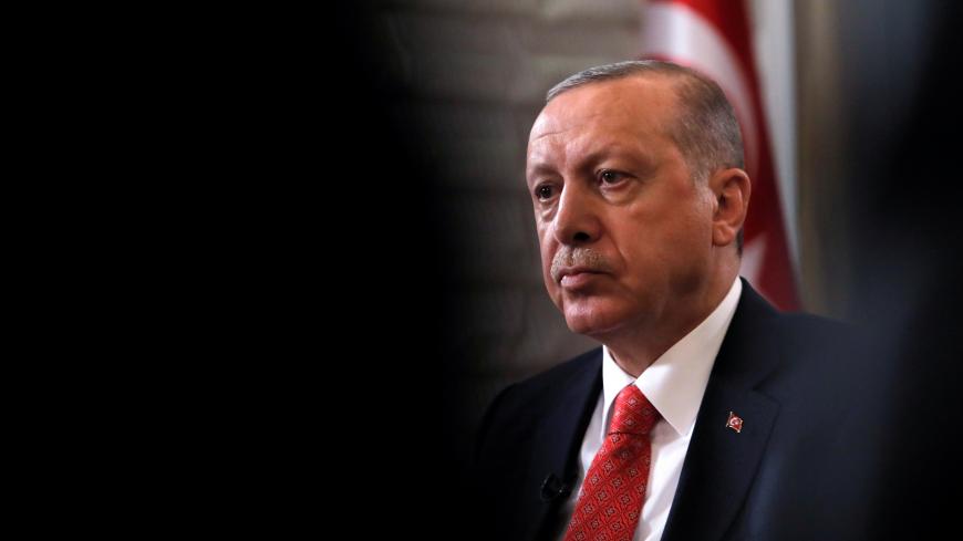 Turkish President Tayyip Erdogan sits during an interview with Reuters in Manhattan, New York, U.S., September 25, 2018. REUTERS/Andrew Kelly - RC1F60EA5800