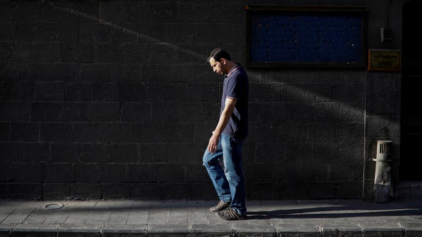 A man walks through the old city of Damascus, Syria, September 12, 2018. Picture taken September 12, 2018. REUTERS/Marko Djurica TPX IMAGES OF THE DAY - RC1AD454BD80