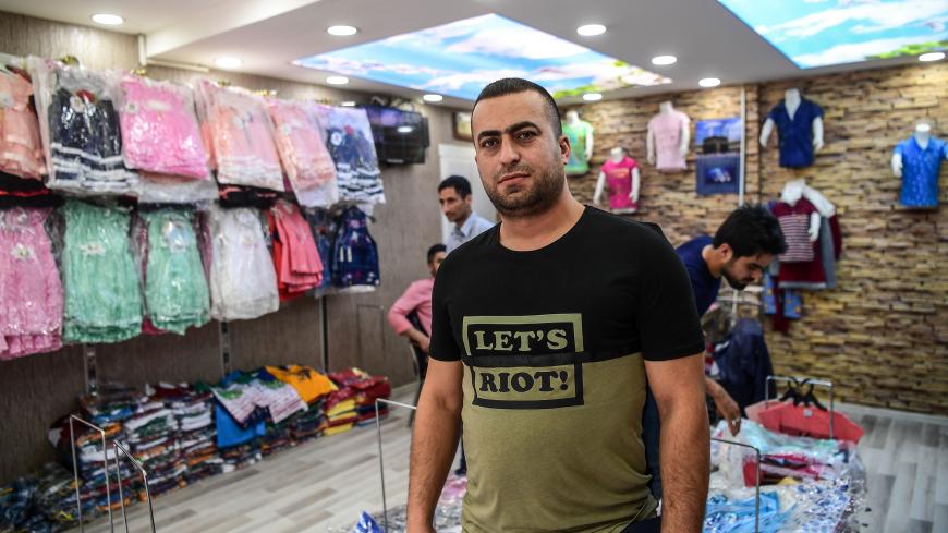 A Syrian shop owner, Mustafa Turkmen, poses during an interview on May 1, 2018 in Gaziantep, southwestern Turkey. - In the Turkish city of Gaziantep, home to around half a million Syrians who fled the civil war south of the border, hundreds of Syrian businesses are thriving in a boost both for the displaced community and their host country. (Photo by OZAN KOSE / AFP) (Photo credit should read OZAN KOSE/AFP/Getty Images)