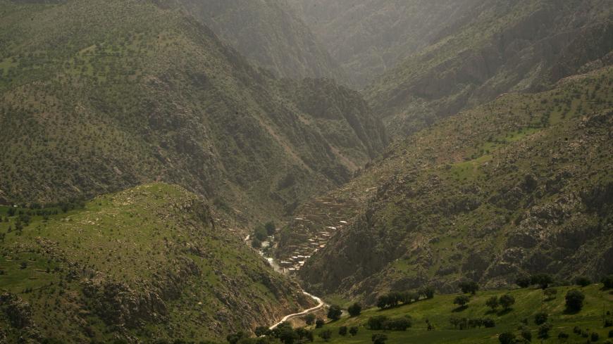 A general view of Palangan village (bottom, C) in Kurdistan province about 660 km (412 miles) southwest of Tehran May 11, 2011. Iranian Shi'ite and Sunni Kurds live in harmony with each other in Palangan, although Sunni is the religion of the majority of the people. REUTERS/Morteza Nikoubazl (IRAN - Tags: CITYSCAPE SOCIETY RELIGION) - GM1E75C0SHZ01