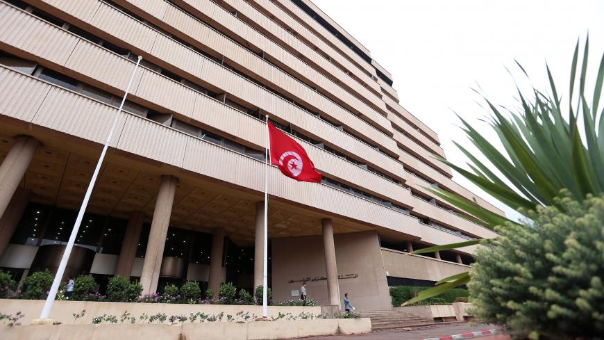 People walk out of the Central Bank in Tunis, Tunisia, October 4, 2017. Picture taken October 4, 2017. REUTERS/Zoubeir Souissi - RC1D352E0220