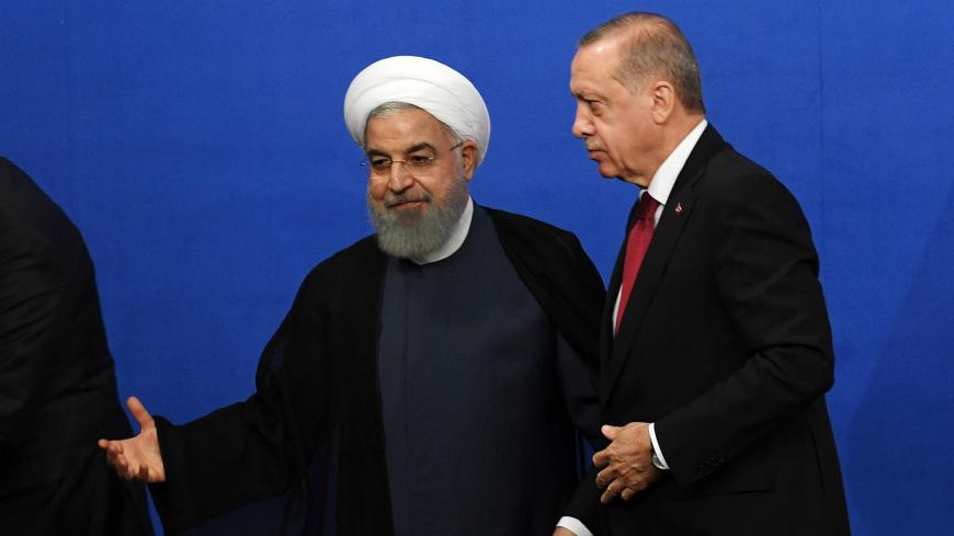 Iranian President Hassan Rouhani and his Turkish counterpart Tayyip Erdogan leave after a news conference in Tehran, Iran September 7, 2018. Kirill Kudryavtsev/Pool via REUTERS - RC14A5A16440