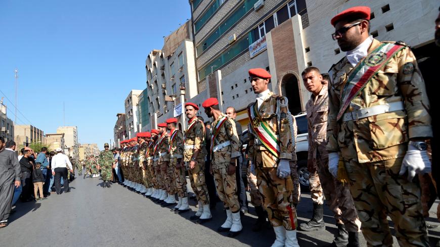 Security men stand during a funeral of the victims of assault that killed 25 people, in the streets of the southwestern Iranian city of Ahvaz , Iran September 24, 2018. Tasnim News Agency/via REUTERS ATTENTION EDITORS - THIS PICTURE WAS PROVIDED BY A THIRD PARTY. - RC16E45E0F20