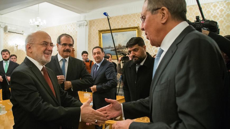 Russian Foreign Minister Sergei Lavrov welcomes his Iraqi counterpart Ibrahim al-Jaafari during a meeting in Moscow, Russia February 26, 2018. REUTERS/Alexander Zemlianichenko/Pool - RC1138BBA8E0