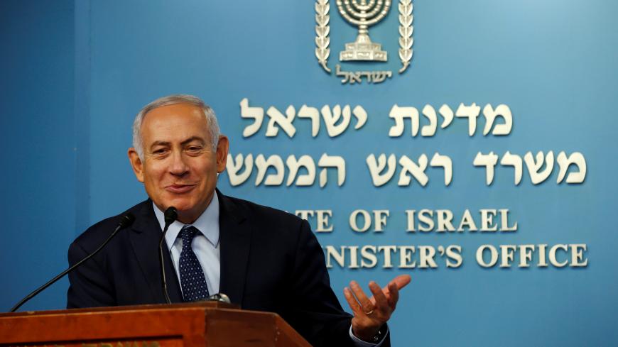 Israeli Prime Minister Benjamin Netanyahu gestures during a news conference, with his Finance Minister Moshe Kahlon, announcing the appointment of the new Bank of Israel Governor, in Jerusalem October 9, 2018. REUTERS/Ronen Zvulun - RC155D556990