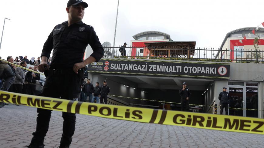 Turkish police officers stand guard at the entrance of a car park where a vehicle belonging to Saudi Arabia's consulate was found, in Istanbul, Turkey October 22, 2018. REUTERS/Huseyin Aldemir - RC1E7AA5AE00