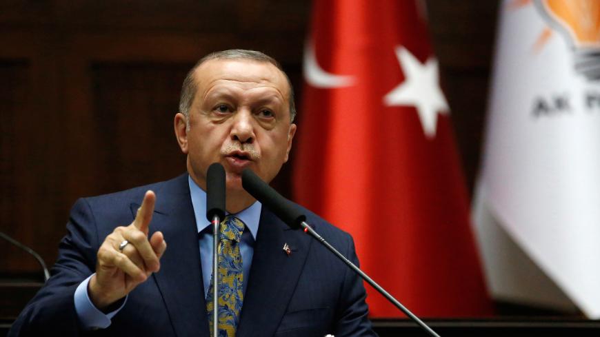 Turkish President Tayyip Erdogan addresses members of parliament from his ruling AK Party (AKP) during a meeting at the Turkish parliament in Ankara, Turkey, October 23, 2018. REUTERS/Tumay Berkin - RC1197CC2600