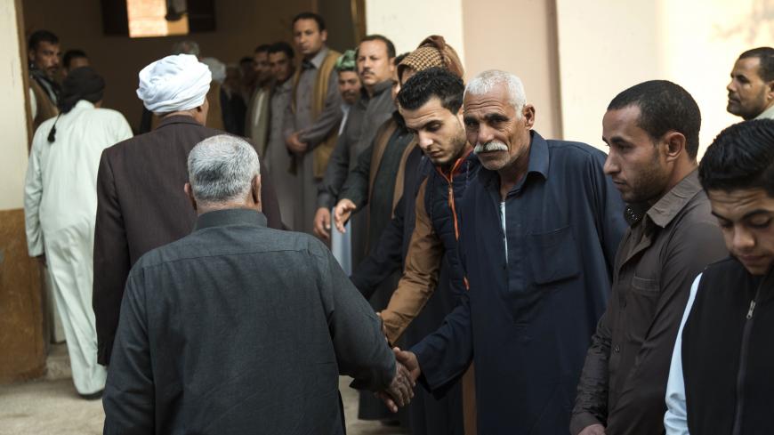 Egyptians attend on November 26, 2017 in the village of Saud, in the centre of al-Husseiniya in the country's northern province of al-Sharqiya, the funeral of Fethy Ismail, the Muadhin of al-Rawda mosque, who died in an attack by militants near the North Sinai provincial capital of El-Arish.
Earlier in the week armed attackers killed over 300 worshippers in a bomb and gun assault on the packed mosque in Egypt's restive North Sinai province, in the deadliest attack the country has witnessed. / AFP PHOTO / MO