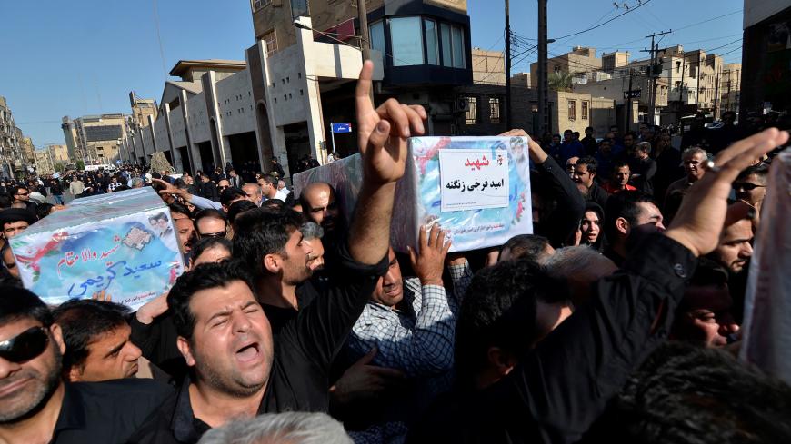 People carry coffins during a funeral of the victims of assault that killed 25 people, in the streets of the southwestern Iranian city of Ahvaz, Iran September 24, 2018. Tasnim News Agency/via REUTERS ATTENTION EDITORS - THIS PICTURE WAS PROVIDED BY A THIRD PARTY. - RC18F3BB4390