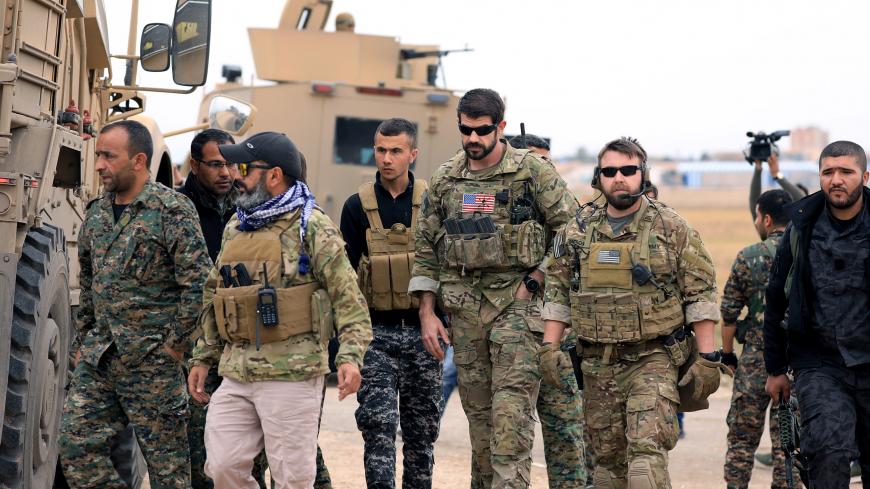 Syrian Democratic Forces and U.S. troops are seen during a patrol near Turkish border in Hasakah, Syria November 4, 2018. REUTERS/Rodi Said - RC1E38C9BA00