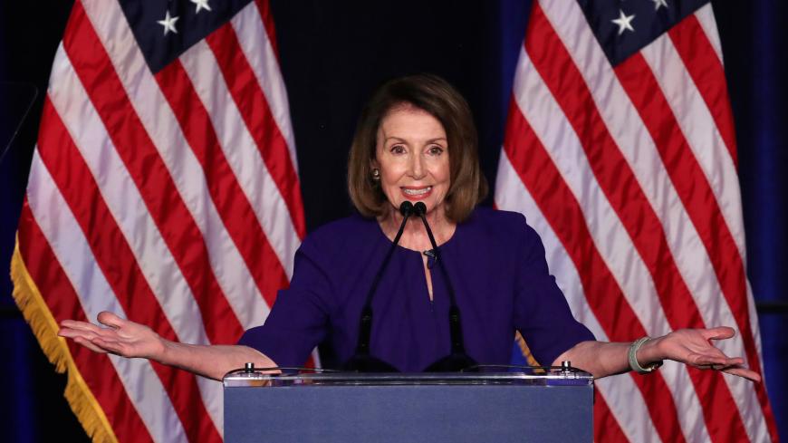 U.S. House Minority Leader Nancy Pelosi reacts to the results of the U.S. midterm elections at a Democratic election night party and rally in Washington, U.S. November 6, 2018. REUTERS/Jonathan Ernst - RC1889CBEC00