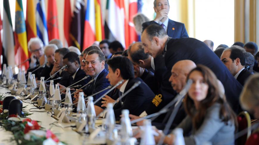 Russian Prime Minister Dmitry Medvedev attends the second day of the international conference on Libya in Palermo, Italy, November 13, 2018. REUTERS/Guglielmo Mangiapane - RC14C7724000