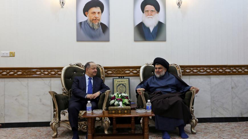 Former Iraqi Kurdish region President Masoud Barzani meets with Iraqi Shi'ite radical leader Muqtada al-Sadr in Najaf, Iraq November 23, 2018. REUTERS/Alaa al-Marjani - RC180BA2F8F0