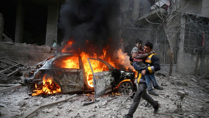 A Syria Civil Defence member carries a wounded child in the besieged town of Hamoria, Eastern Ghouta, in Damascus, Syria, January 6, 2018. REUTERS/ Bassam Khabieh     SEARCH "POY GLOBAL" FOR FOR THIS STORY. SEARCH "REUTERS POY" FOR ALL BEST OF 2018 PACKAGES. TPX IMAGES OF THE DAY. - RC12D7212D70