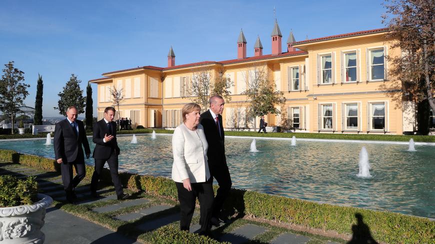 French President Emmanuel Macron, Turkish President Tayyip Erdogan, Russian President Vladimir Putin, German Chancellor Angela Merkel walk at the Vahdettin Mansion, during a summit on Syria, in Istanbul, Turkey October 27, 2018. Kayhan Ozer/Pool via REUTERS - RC1258FD9310