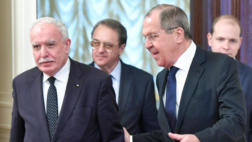 Russian Foreign Minister Sergei Lavrov (R) welcomes his Palestinian counterpart Riyad al-Maliki (L) ahead of their meeting, in Moscow, on December 21, 2018. (Photo by Alexander NEMENOV / AFP)        (Photo credit should read ALEXANDER NEMENOV/AFP/Getty Images)