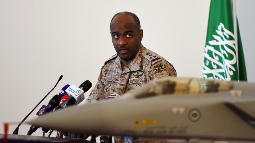 Saudi Brigadier General Ahmed Asiri, spokesman of the Saudi-led coalition forces, speaks to the media next to a replica of a Tornado fighter jet, at the Riyadh airbase in the Saudi capital on March 26, 2014. Speaking to reporters in the Saudi capital, spokesman Ahmed Assiri also said that there were no immediate plans for a ground offensive but that the coalition would not allow any supplies to reach the rebels. AFP PHOTO / FAYEZ NURELDINE        (Photo credit should read FAYEZ NURELDINE/AFP/Getty Images)