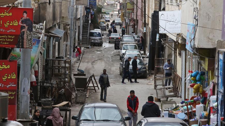 Palestinian refugees walk on January 18, 2018 at the al-Baqa'a refugee camp, some 20 kilometres north of Amman, which was built as an emergency camp in 1968 to house Palestinians who left the West Bank and Gaza Strip after the IsraeliArab war in 1967. 
The US government has frozen tens of millions of dollars in contributions to the UN agency for Palestinian refugees, UNRWA. / AFP PHOTO / Khalil MAZRAAWI        (Photo credit should read KHALIL MAZRAAWI/AFP/Getty Images)