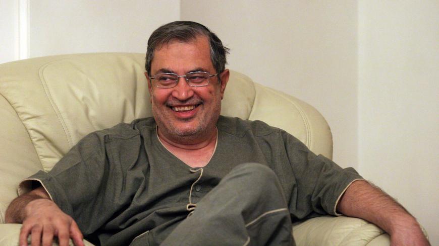 Iran's leading reformist politician Saeed Hajjarian smiles as he receives guests at home following his release from prison in Tehran on September 30, 2009. Iran granted bail to Hajjarian, who was arrested in the aftermath of President Mahmoud Ahmadinejad's hotly disputed June re-election. A key member of the reformist Islamic Iran Participation Front who survived a 2000 assassination attempt, Hajjarian was among scores of reformist activists and journalists detained when the regime cracked down on the prote