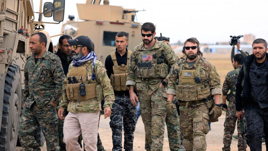 Syrian Democratic Forces and U.S. troops are seen during a patrol near Turkish border in Hasakah, Syria November 4, 2018. REUTERS/Rodi Said - RC1E38C9BA00
