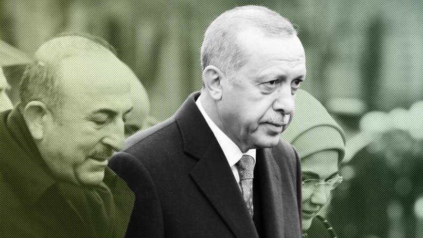 Turkish President Recep Tayyip Erdogan and Turkish Foreign Minister Mevlut Cavusoglu leave a commemoration ceremony for Armistice Day, 100 years after the end of the First World War, at the Arc de Triomphe, in Paris, France, November 11, 2018. Ludovic Marin/Pool via REUTERS - RC14BD6A5800