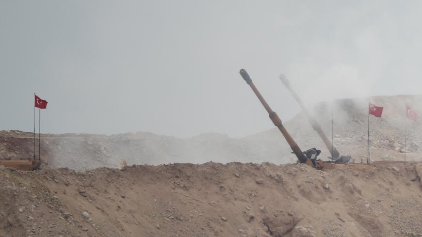 A Turkish army howitzer fires from a military post on the Turkish-Syrian border in Hatay province, Turkey February 26, 2018. REUTERS/Umit Bektas - RC1DA3686FA0