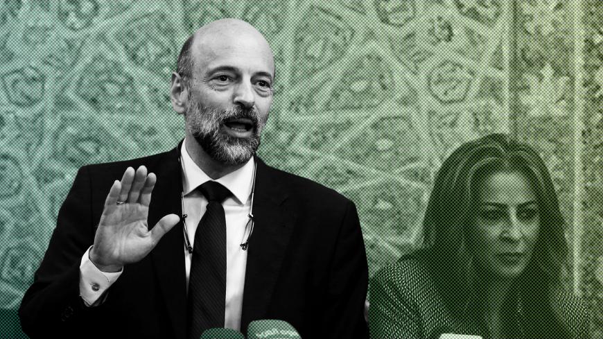 Jordan's Prime Minister Omar al-Razzaz and Minister of State for Media Affairs Jumana Ghunaimat arrive for their news conference in Amman, Jordan June 19, 2018. REUTERS/Muhammad Hamed - RC124FDF1330