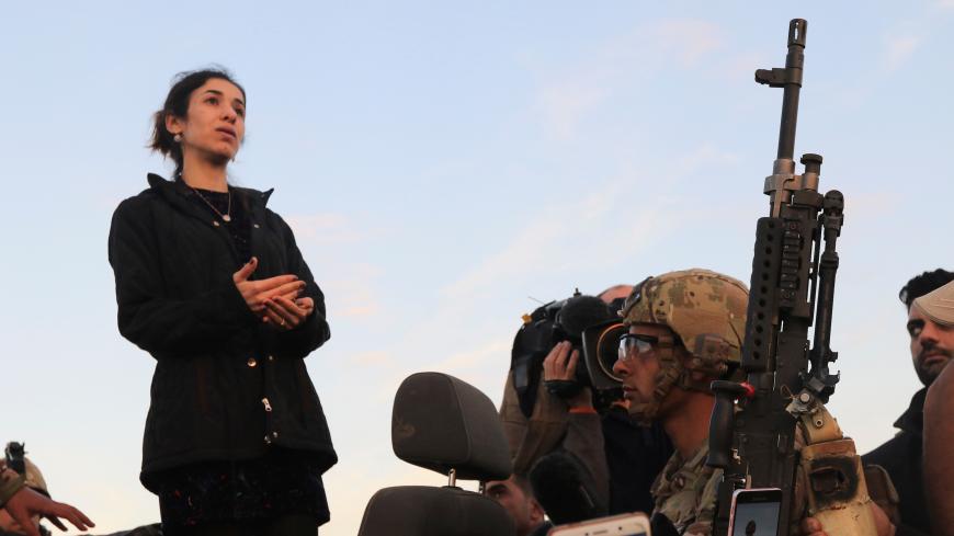 Nobel Peace Prize laureate, Yazidi activist Nadia Murad gestures while talking to people during her visit to Sinjar, Iraq December 14, 2018. REUTERS/Ari Jalal - RC19D80529C0