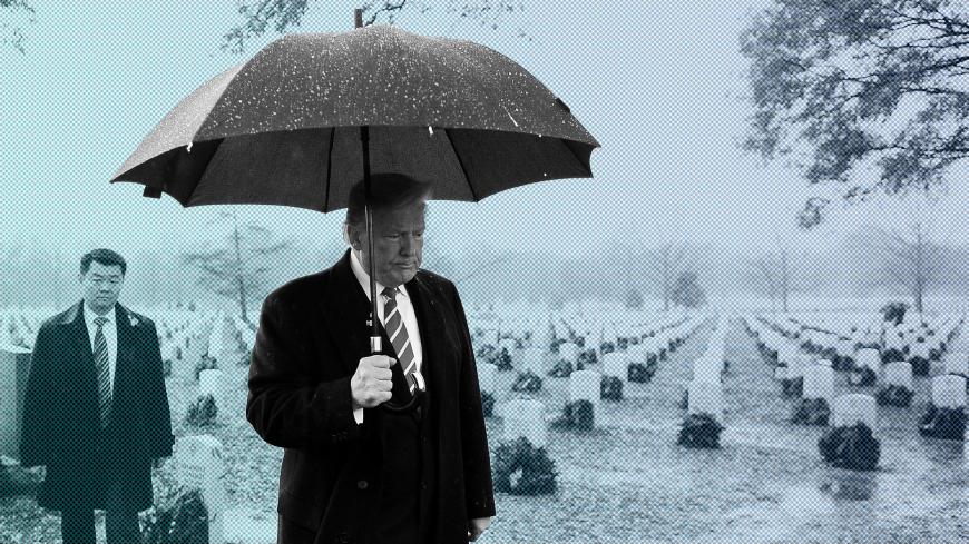 U.S. President Donald Trump visits Section 60 in Arlington Cemetery in Arlington, U.S., December 15, 2018. REUTERS/Mary F. Calvert TPX IMAGES OF THE DAY - RC1FCDFDEB70