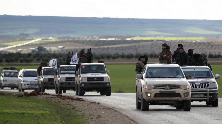 Turkish-backed Syrian rebels ride on trucks at Manbij countryside, Syria December 28, 2018. REUTERS/Khalil Ashawi - RC12E3699180