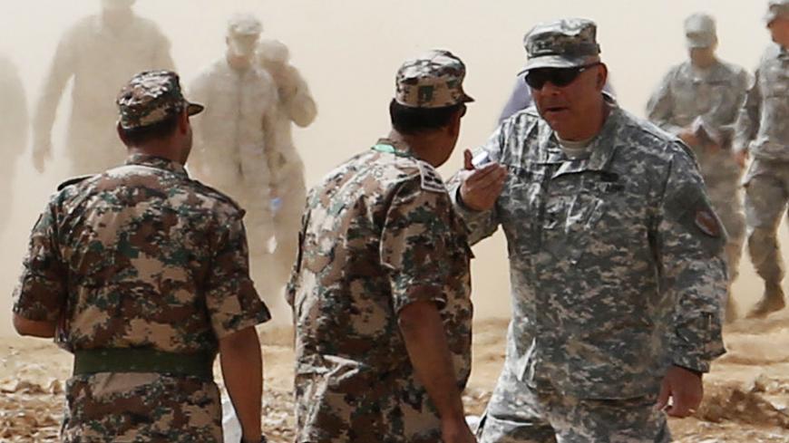 U.S. Army Maj. Gen. Robert Catalanotti (R), director, Exercises and Training Directorate J-7, U.S. Central Command arrives to take part in the "Eager Lion" military exercises at the Jordan-Saudi Arabia border, 260 km (162 miles) south of Amman June 5, 2014. Around 12,500 participants from 20 countries will take part in Eager Lion. REUTERS/Muhammad Hamed (JORDAN - Tags: MILITARY POLITICS) - GM1EA651SJJ01
