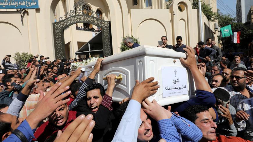 Mourners carry a coffin during the funeral of Coptic Christians who were killed in an attack, in Minya, Egypt November 3, 2018. REUTERS/Mohamed Abd El Ghany - RC193E912290