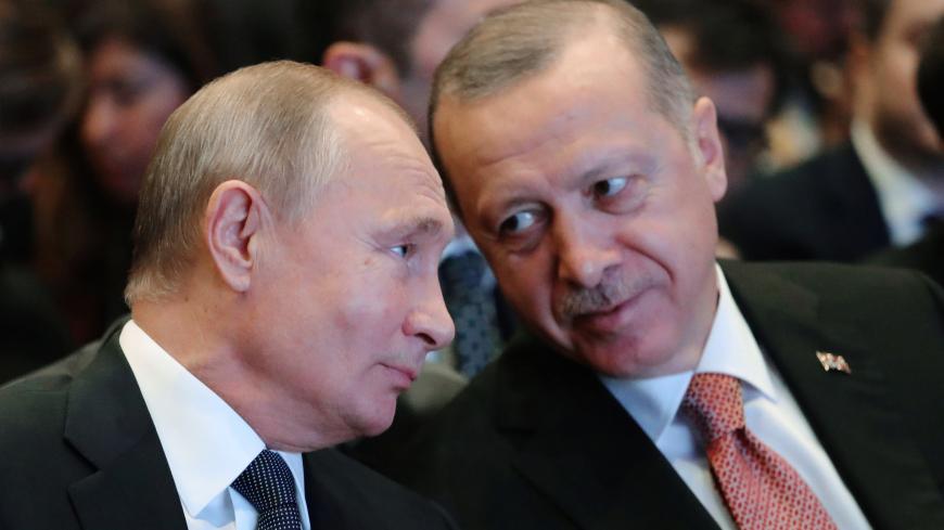Russian President Vladimir Putin (L) and his Turkish counterpart Tayyip Erdogan speak during a ceremony to mark the completion of the sea part of the TurkStream gas pipeline, in Istanbul, Turkey November 19, 2018. Sputnik/Mikhail Klimentyev/Kremlin via REUTERS  ATTENTION EDITORS - THIS IMAGE WAS PROVIDED BY A THIRD PARTY. - RC12DCA255B0