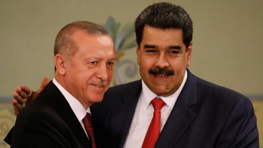 Turkish President Tayyip Erdogan and Venezuela's President Nicolas Maduro attend a news conference after an agreement-signing ceremony between Turkey and Venezuela at Miraflores Palace in Caracas, Venezuela December 3, 2018. REUTERS/Manaure Quintero - RC149F4F7600
