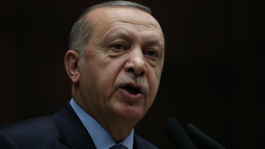 Turkish President Tayyip Erdogan addresses members of parliament from his ruling AK Party (AKP) during a meeting at the Turkish parliament in Ankara, Turkey, January 8, 2019. REUTERS/Umit Bektas - RC15DCD0F010