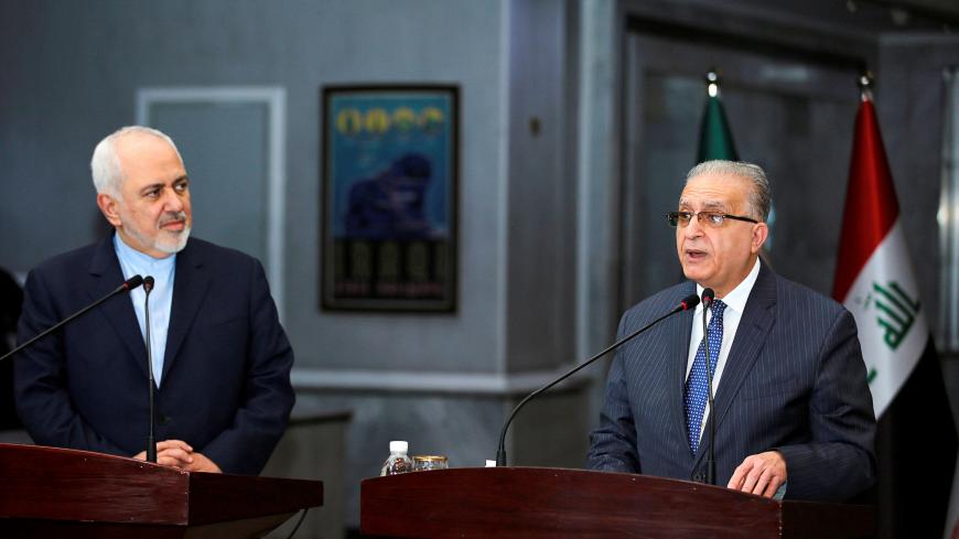 Iraqi Foreign Minister Mohamed Ali Alhakim speaks with his Iranian counterpart Mohammad Javad Zarif during news conference, in Baghdad, Iraq January 13, 2019. REUTERS/Khalid Al-Mousily - RC17491CB760