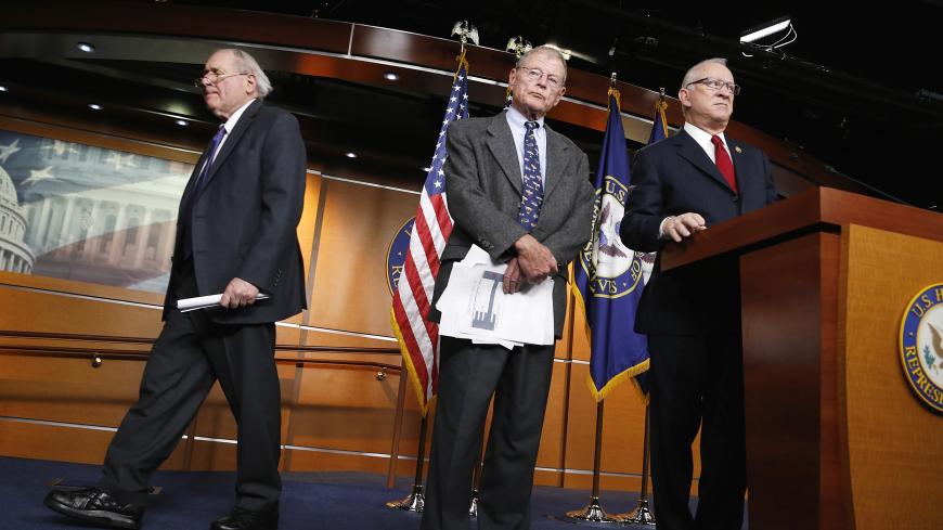 U.S. Senator Carl Levin (D-MI) (L) and Representative Buck McKeon (R-CA) (R), chairmen of the Senate and House Armed Services Committees, with Senator Jim Inhofe (R-OK) (C), hold a news conference to talk about progress between the two chambers on the National Defense Authorization Act for fiscal year 2014, at the U.S. Capitol in Washington December 9, 2013. REUTERS/Jonathan Ernst (UNITED STATES - Tags: POLITICS MILITARY) - GM1E9CA0IUV01
