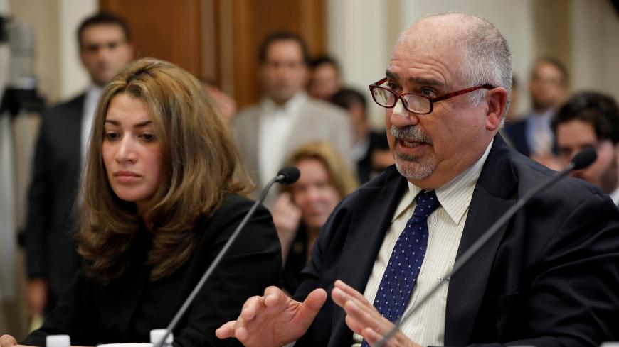 Protester Murat Yusa testifies before the House Foreign Affairs Europe, Eurasia and Emerging Threats Subcommittee about the attack on demonstrators by members of Turkish President Recep Tayyip Erdogan's security detail on Capitol Hill in Washington, D.C., U.S. May 25, 2017. REUTERS/Aaron P. Bernstein - RC1E7F50C930