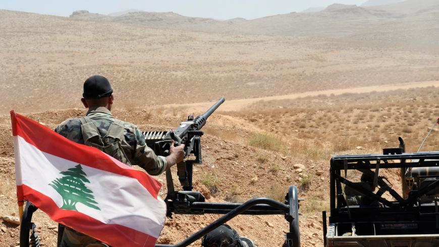 Lebanese Army soldiers ride on their military vehicles in Ras Baalbek, Lebanon August 28, 2017. REUTERS/Hassan Abdallah - RC176820F100