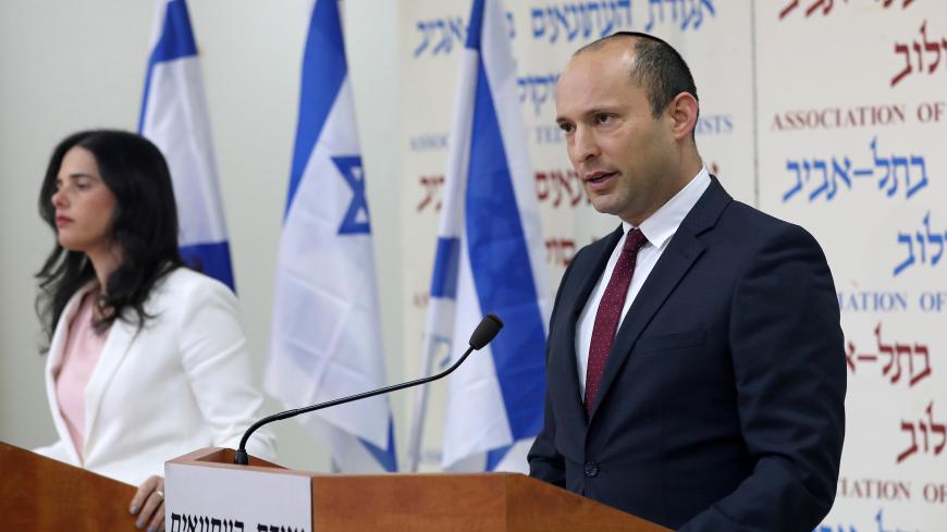 Israeli Education Minister Naftali Bennett (R) and Justice Minister Ayelet Shaked, from the Jewish Home party, deliver statements in Tel Aviv, Israel December 29, 2018. REUTERS/Corinna Kern - RC15EB02E090
