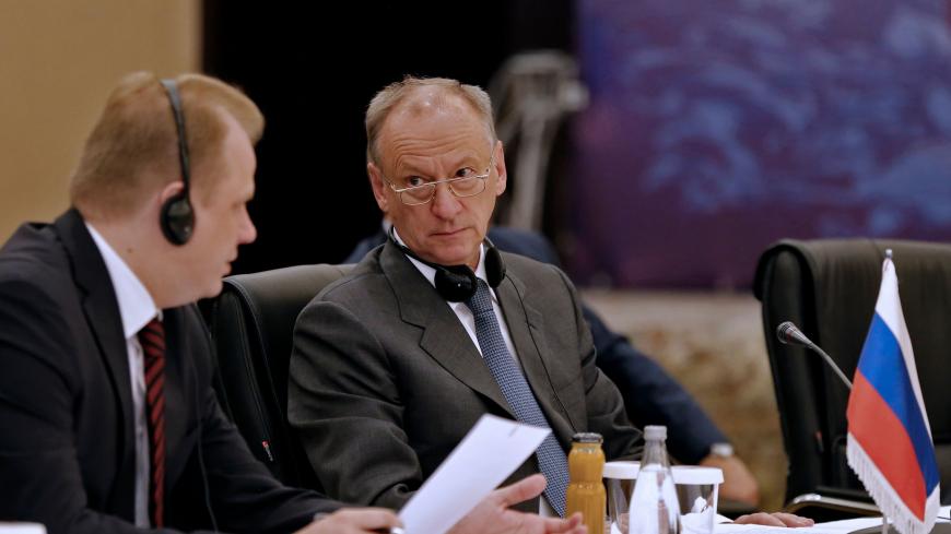Nikolai Patrushev (R), Secretary of the Security Council of Russia (R) listens during the first meeting of national security secretaries of Afghanistan, China, Iran, India and Russia, in the Iranian capital Tehran on September 26, 2018. (Photo by ATTA KENARE / AFP)        (Photo credit should read ATTA KENARE/AFP/Getty Images)