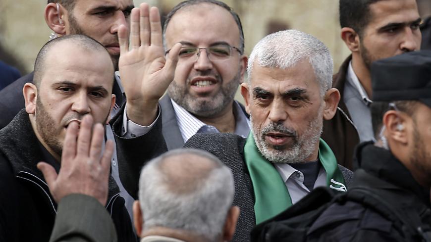 Hamas' leader in the Gaza Strip Yahya Sinwar (1st-R) waves upon his arrival at a rally marking the 31st anniversary of Hamas' founding, in Gaza City December 16, 2018. (Photo by SAID KHATIB / AFP)        (Photo credit should read SAID KHATIB/AFP/Getty Images)