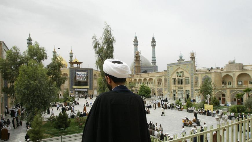 QOM, IRAN:  TO GO WITH AFP STORY: IRAN -VOTE-RELIGION-CLERICS An Iranian cleric student looks at the courtyard of Faiziyeh religious school in Iran's clerical capital Qom, 120 kms south of Tehran, 18 May 2005. It was in this desert city where it all began 42 years ago: Ayatollah Ruhollah Khomeini branded the shah of Iran a "wretched, miserable man", and set in motion a series of events that led to the Islamic revolution. Khomeini's theocracy, where Shiite clerics exercise absolute power, is now 26 years old