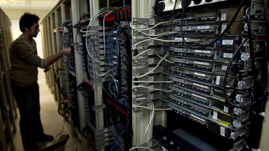 A computer engineer checks equipment at an internet service provider in Tehran February 15, 2011. Websites like Facebook, Twitter, YouTube and countless others were banned shortly after the re-election of Iran's President Mahmoud Ahmadinejad and the huge street protests that followed. Seen by the government as part of a "soft war" waged by the enemies of the Islamic Republic, social networking and picture sharing sites were a vital communication tool for the anti-Ahmadinejad opposition -- more than a year b