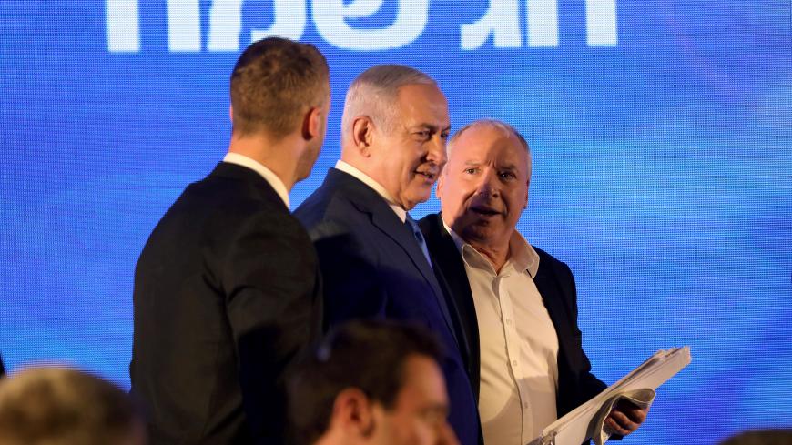 Israeli Prime Minister Benjamin Netanyahu (C) attends a Likud Party gathering marking the first day of the eight-day Jewish holiday of Hanukkah, in Ramat Gan, Israel December 2, 2018. REUTERS/Corinna Kern - RC1B99A9AC70