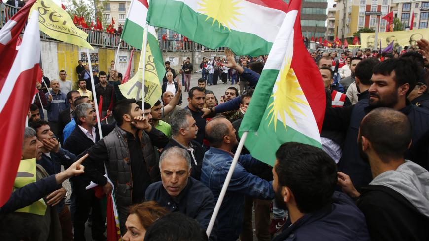 Protestors with flags of Kurdistan scuffle with policemen in plain clothes during a May Day demonstration in Istanbul, Turkey, May 1, 2016.    REUTERS/Murad Sezer - LR1EC510RJ66T