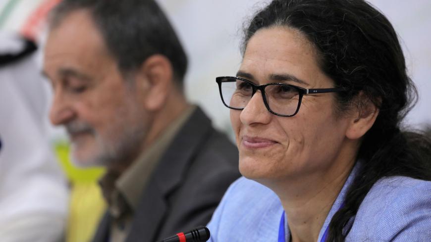 Riad Darar and Ilham Ahmed co-chair's of the Syrian Democratic Council (SDC) are seen during the third meeting in Tabqa, Syria July16, 2018. REUTERS/Rodi Said - RC150A9F38B0