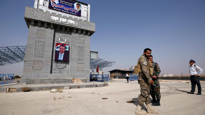 Syrian army soldiers are seen at the Nasib border crossing with Jordan in Deraa, Syria October 15, 2018. REUTERS/Omar Sanadiki - RC153DE05A00