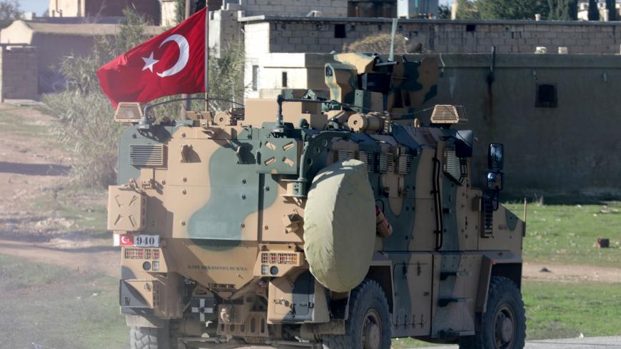 A Turkish military vehicle drives at Manbij countryside, Syria December 29, 2018. REUTERS/Khalil Ashawi - RC11D6A7B320